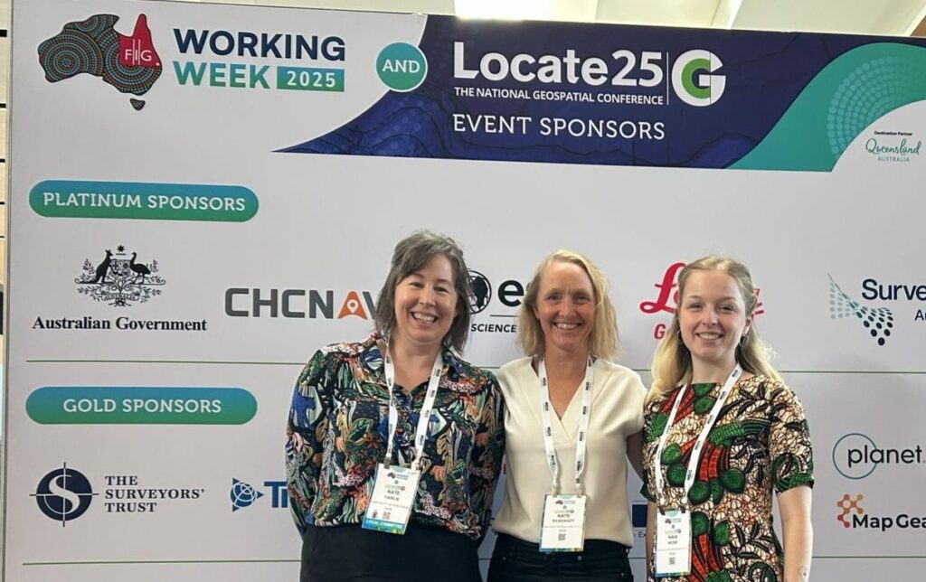 Kate Fairlie, Kate Rickersey and Naia Webb at FIG2025 Locate 2025, the joint international and national geospatial conference held in Brisbane, Australia in April 2025